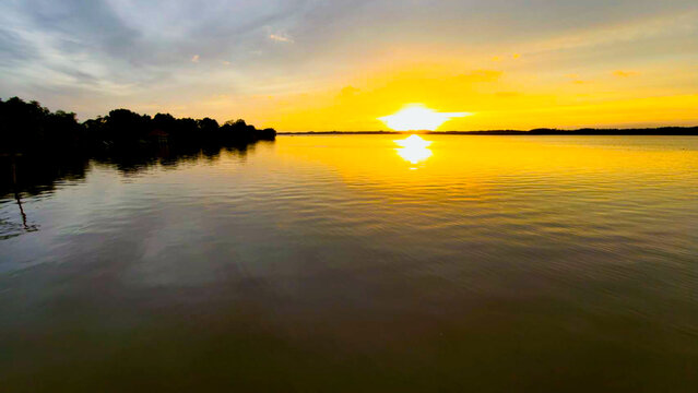 Golden Sunset Over Calm River Water