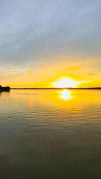 Golden Sunset Over Calm River Water