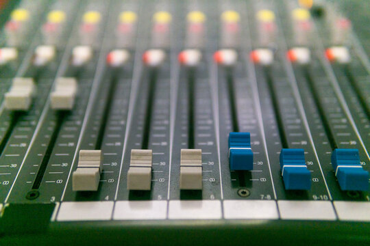 Audio mixing console in the studio. Selective focus. Blur.
