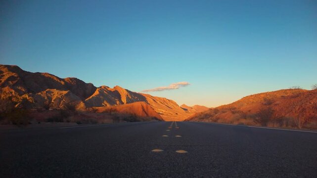 Empty Desert Road Toward Lake Mead at Sunset, Nevada