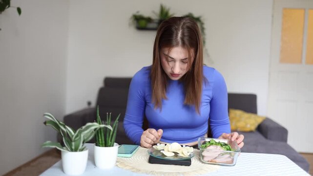 High calorie snacks become a daily temptation as a determined woman refuses extra potato chips to protect her weight loss progress and stay true to her diet