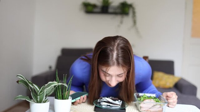 Strict calorie tracking turns every sweet into a calculated decision as a determined woman checks nutrition values before allowing dessert into her daily diet