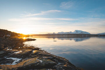 Fototapeta premium Wide view from a rocky shore beside Balsfjord in Troms, Northern Norway