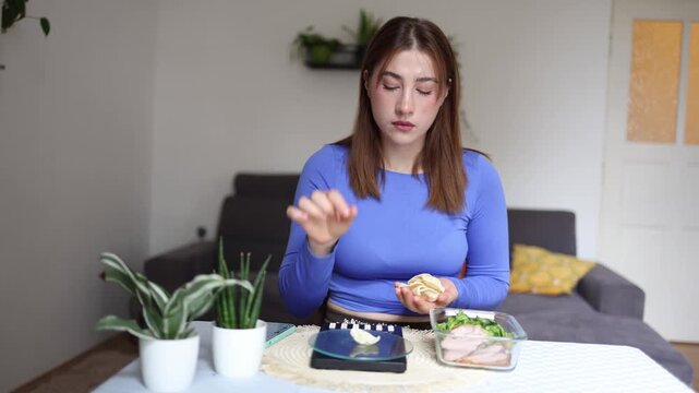 Healthy eating becomes a numbers game as a disciplined woman weighs every potato chip before adding it to her meal plan to avoid breaking strict calorie limits