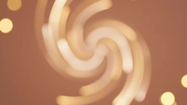 Abstract golden light streaks swirling on a soft brown background