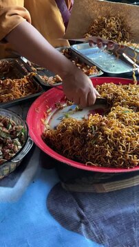 Indonesian Street Food Buffet with Mie Goreng Fried Noodles and Side Dishes