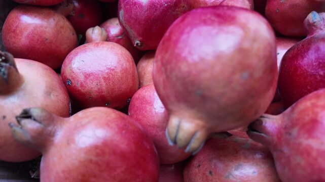 Fresh Pomegranate Falling in Slow Motion , red antioxidant rich fruits