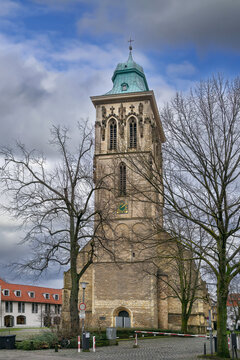 St. Martini church, Munster, Germany, facade view. Historic gothic architecture building sandstone exterior under daytime sky.