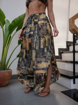 Close up of woman modeling flowing patterned wide leg pants