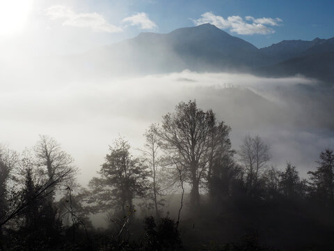 Misty sunrise over the Apennine mountains near Rigoso, Italy.