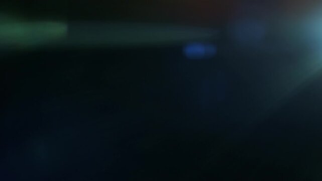 Real Shooted Anamorphic Lens Flare on Black Background in Super Slow Motion.