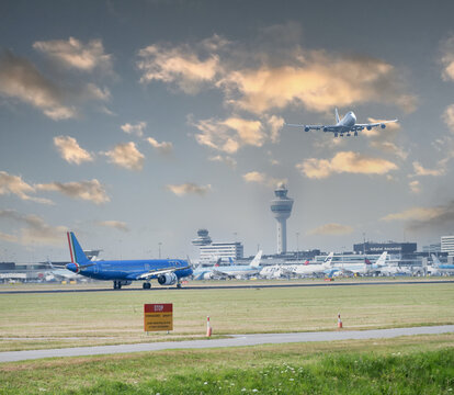 July 30, 2026. Netherlands, Amsterdam. Amsterdam Schiphol Airport with Aircraft and Control Tower