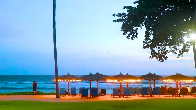 Luxury Marriott Phuket promenade palms sunset Merlin Beach turquoise water Thailand.
