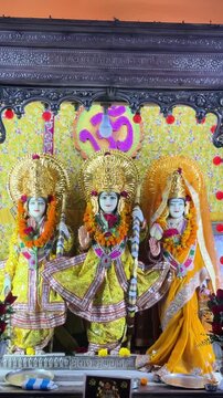 Beautifully decorated idols of Lord Rama, Goddess Sita, and Lord Lakshman displayed inside a Hindu temple, symbolizing righteousness, devotion, family values, and divine blessings.