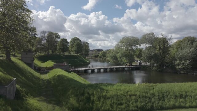 Green ramparts and moat of Kastellet with spring trees