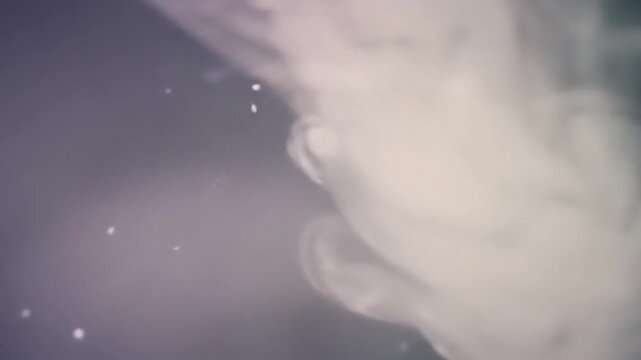 Abstract Fluid Dynamics Ethereal Ink Swirls in Water Soft Pastel Colors Blending Gracefully.