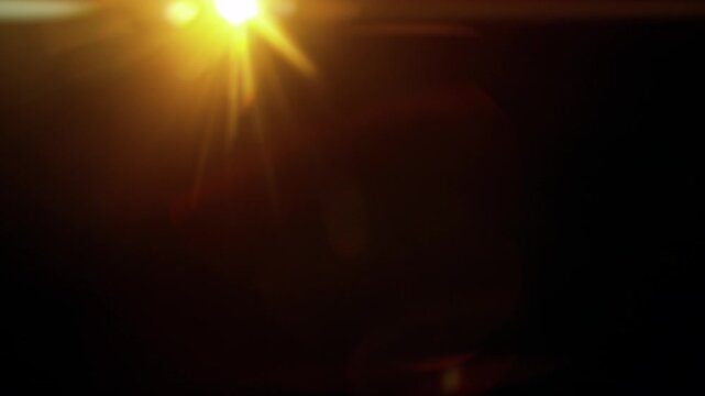 Real Shooted Anamorphic Lens Flare on Black Background in Super Slow Motion.