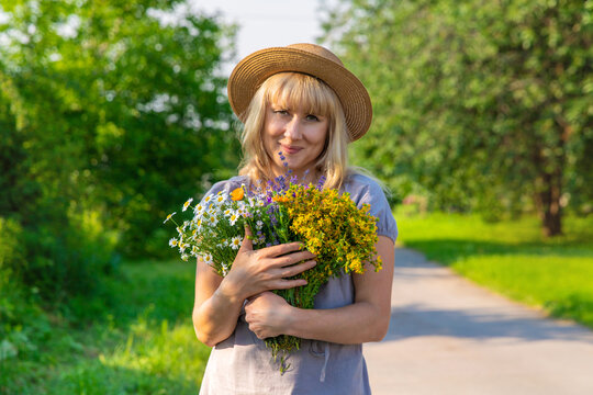 Woman with medicinal herbs. Selective focus.