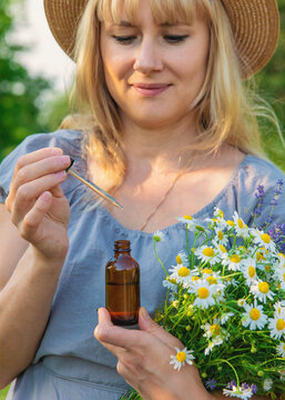 Woman with medicinal herbs. Selective focus.