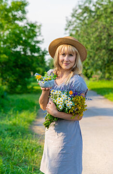 Woman with medicinal herbs. Selective focus.