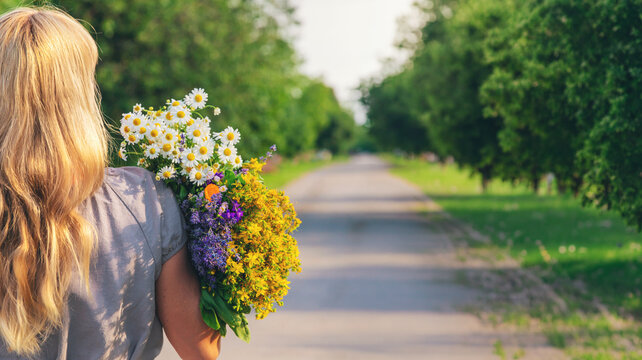 Woman with medicinal herbs. Selective focus.