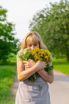 Woman with medicinal herbs. Selective focus.