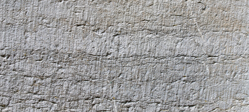 light grey stone surface texture background with weathered fine cracks