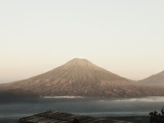 amazing landscape view of mount sumbing while sunrise, indonesian volcanic mountains ,mid java, indonesia © ALI