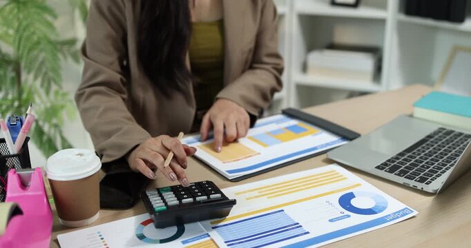 Businesswoman presenting financial reports and performance charts during business meeting, explaining data analysis, company results and strategic planning for finance, management and corporate growth