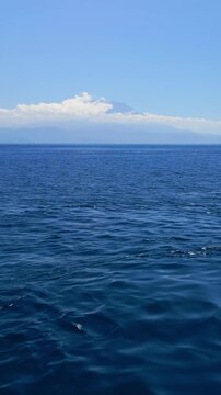Aerial High-Speed Ocean Flight Toward Bali With Distant Agung Hidden In Clouds