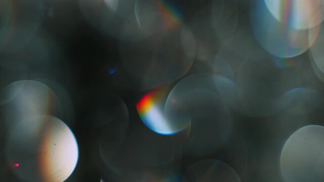 Real Shooted Cinematic Light Bokeh Overlay on Black Background in Slow Motion.