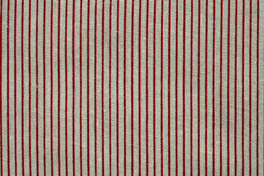 Red and white striped fabric showing a detailed textile texture