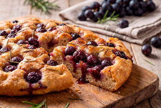 Rustic Tuscan schiacciata con l'uva sweet focaccia with baked black grapes and rosemary