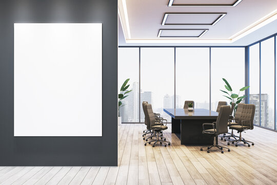 Blank vertical poster frame mockup in a modern office conference room, clean presentation display concept with light interior background. 3D Rendering