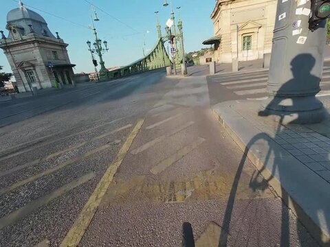 Low water level of the Danube river in Budapest at sunrise, featuring the Liberty Bridge and the uncovered Inseg Rock, and the Margit bridge and the island. 02.08.2026.