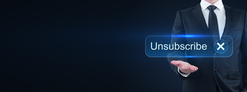 Businessman presenting unsubscribe button with glowing blue interface on dark background, digital communication opt-out concept and copy space design.