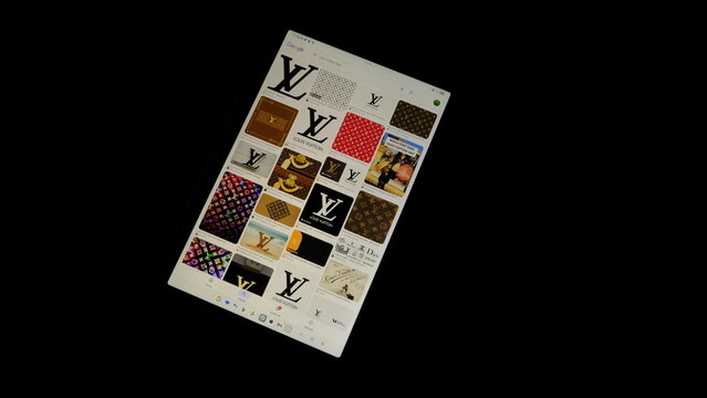 Tablet screen view with various sized Louis Vuitton logos, on a black background, August 1, 2026	
