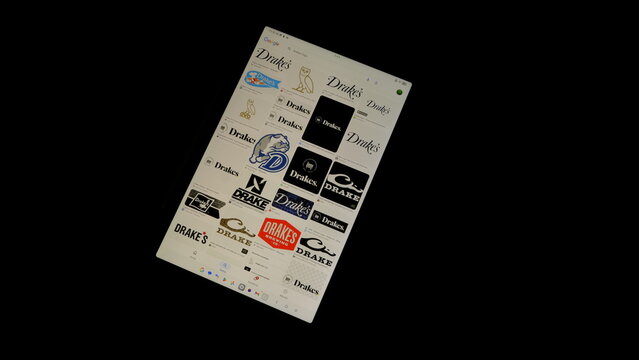 Tablet screen view with various sized Drakes logos, on a black background, August 1, 2026