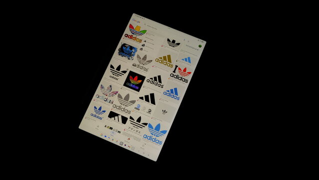 Tablet screen view with various sized Adidas logos, on a black background, August 1, 2026