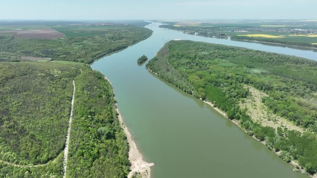 Aerial View of Wide River Bend with Forested Island in Danube River, Rural Landscape