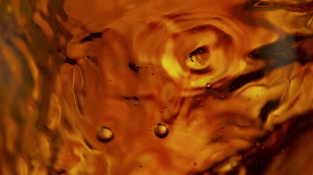 Super Slow Motion Shot of Waving Golden Liquid Background at 1000fps.