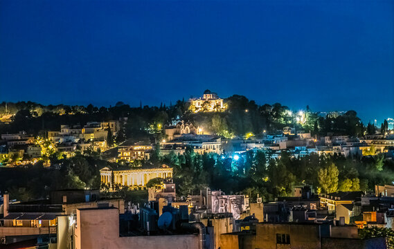 A view at night over the rooftops of Athens in Athens, Greece in early summertime