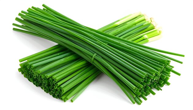 A neat bundle of long slender green garlic chives buchu arranged horizontally on a white studio surface