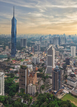 Kuala Lumpur, Malaysia - February 18, 2025: Aerial view of the Kuala Lumpur city skyline featuring the iconic Merdeka 118 skyscraper and Maybank Tower during a scenic golden hour sunset