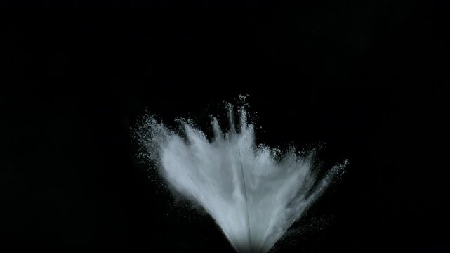 Super Slow Motion Shot of White Powder Blow Isolated on Black Background at 1000fps.