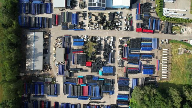 Aerial top down view of industrial pipe storage yard