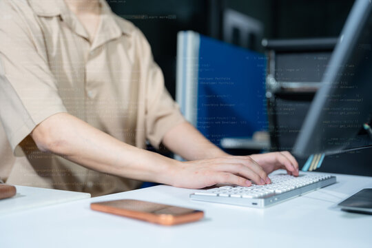 Hacking and malware concept. Hacker using abstract laptop with binary code digital interface.