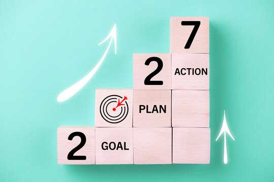 2027 New Year card. New Years goals 2027 with wooden cube, target icon. Concept 2027 New Year background. Goal, plan, action, business, resolutions,  financial, success, ideas