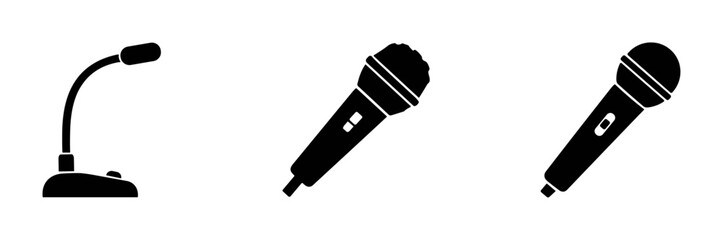 Black silhouette icons of different types of microphones including table microphone and handheld microphones on white background © Tanya
