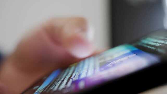 Person scrolling through content on smartphone